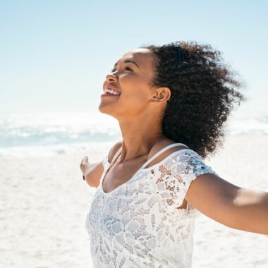 Person smiling on the beach